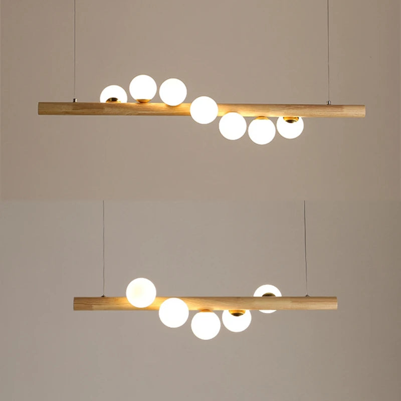 Modern pendant lights with wooden fixtures and white bulbs on a beige background