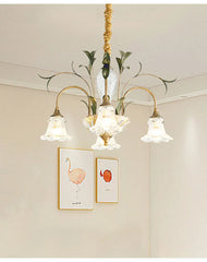 Gold floral crystal semi-flush chandelier installed in a room with artwork