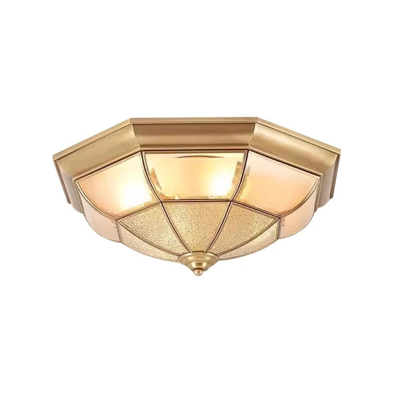 Gold ceiling light fixture on a white background