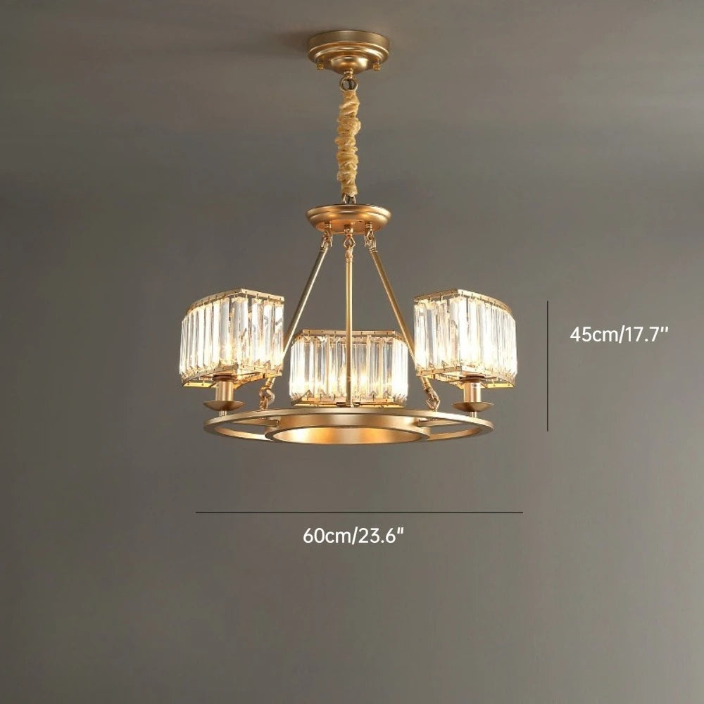 Gold chandelier with crystal-like glass shades on a gray background