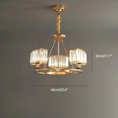 Gold chandelier with crystal-like glass shades on a gray background