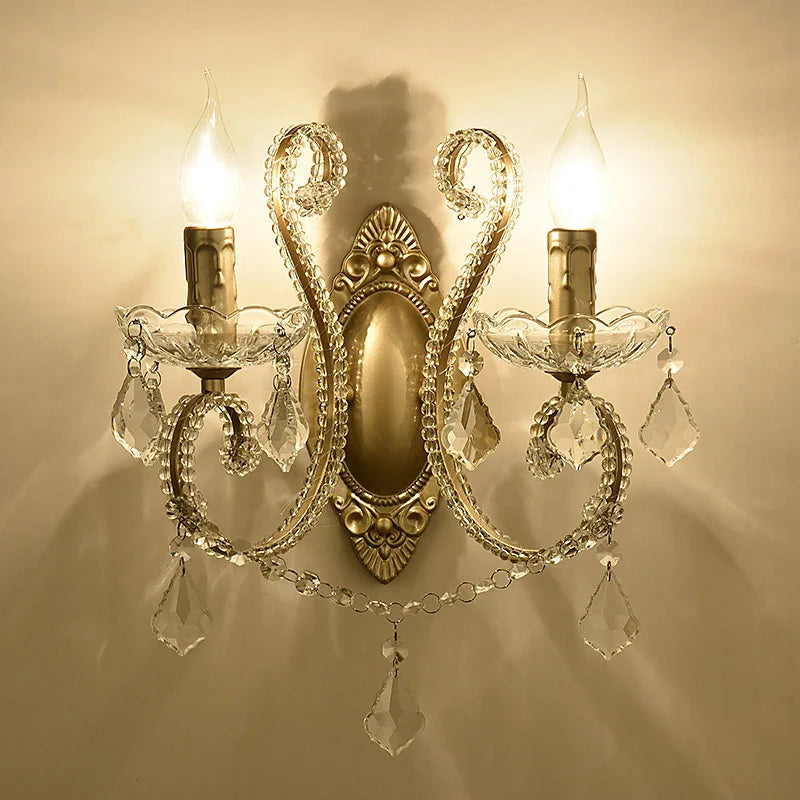 Decorative wall sconce with crystal accents on a beige wall.