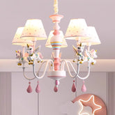 Pink and white chandelier with unicorn figurines and polka dot fabric shades, flush mount style.