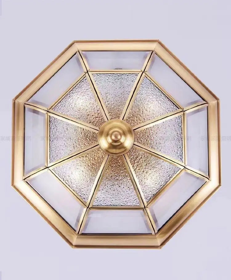 Decorative wall light fixture with geometric design on a white background