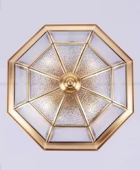 Decorative wall light fixture with geometric design on a white background
