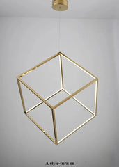 Gold geometric pendant light fixture on a gray background