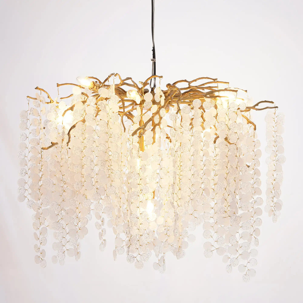 Chandelier with gold branches and white beads on a white background