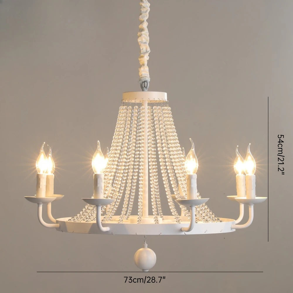 Chandelier with crystal accents and candle-style lights on a neutral background