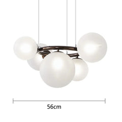 Modern chandelier with five white glass spheres on a white background