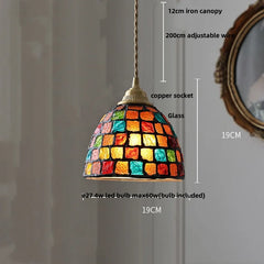 Colorful stained glass pendant light with dimensions on a neutral background