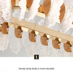 Gold and crystal chandelier with text about lamp durability