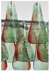 Set of glass pendant lights with a green and red marbled pattern on a white background