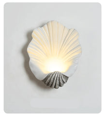 Shell-shaped wall light on a gray background