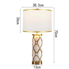 Table lamp with dimensions indicated on a white background