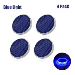 Four blue solar lights with one illuminated on a white background