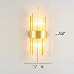Gold wall lamp with dimensions on a light gray background