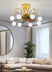 Modern living room with a gold chandelier, beige sofa, and decorative plants.