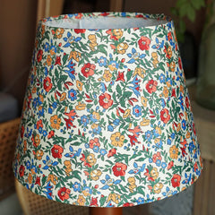 Floral patterned lampshade on a blurred background