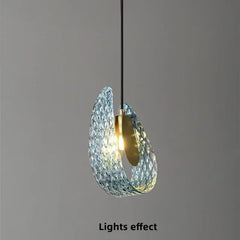 Modern pendant light with crystal design on a gray background
