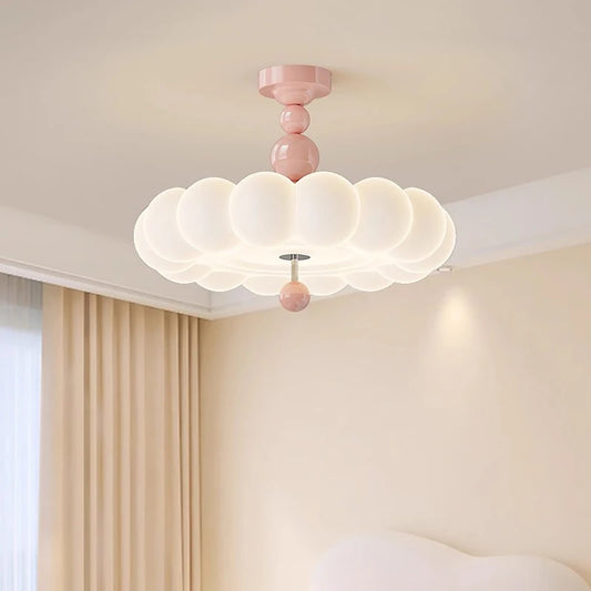 Pink cloud-shaped ceiling light with an opal glass diffuser and pink spherical accents, mounted flush to a white ceiling.