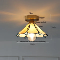 Ceiling light fixture with stained glass shade and measurements on a neutral background