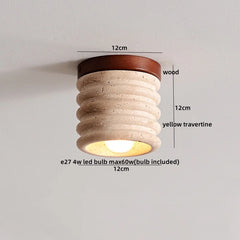 Detailed shot of a yellow travertine flush mount light with dimensions and material callouts: 12cm diameter, 12cm height, wood canopy, yellow travertine body, E27 bulb.