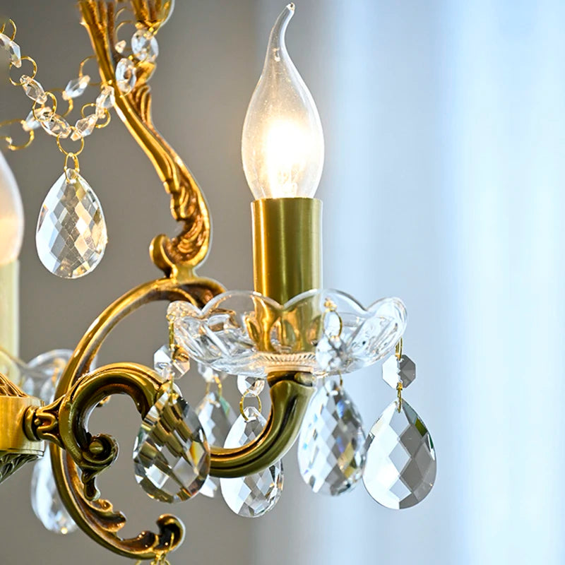 Close-up of a chandelier with crystal accents and a blurred background
