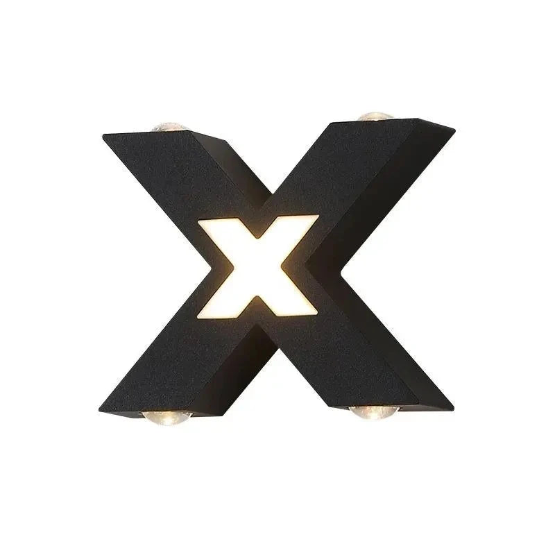 Black letter 'X' wall light fixture on a white background