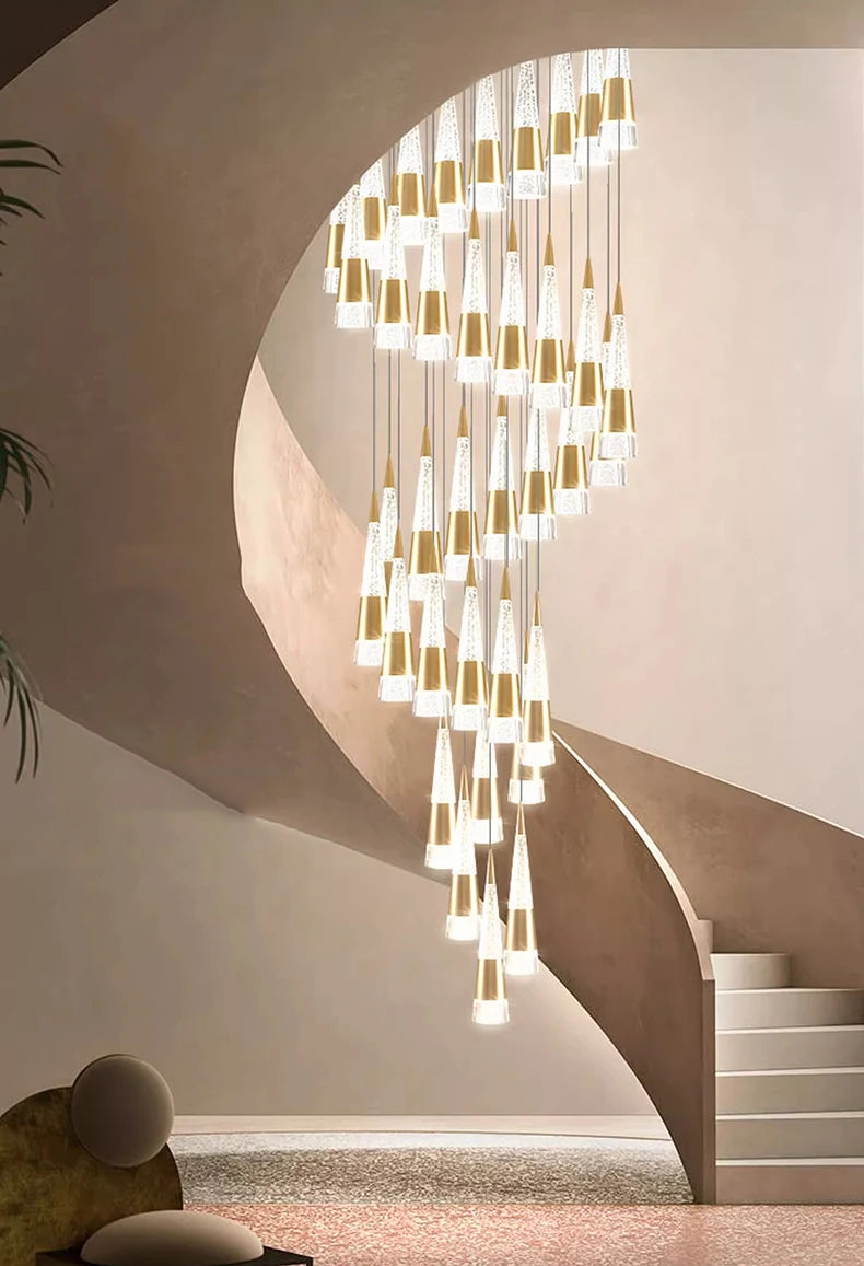 Modern chandelier hanging in a staircase with a neutral color palette