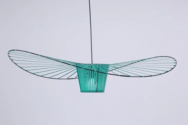 Modern green pendant light against a white background