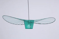 Modern green pendant light against a white background