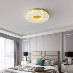 Modern bedroom with a ceiling light fixture, bed, and side tables.
