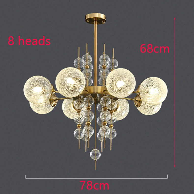 Chandelier with eight glass globe lights on a dark background, showing dimensions.