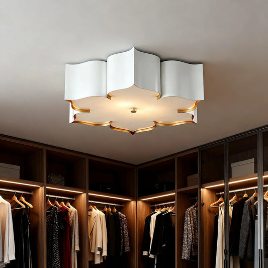 Gold floral semi-flush ceiling light with scalloped edges and gold trim, installed on a white ceiling.