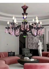 A vibrant multi-colored crystal chandelier with candelabra-style arms, featured in a stylish living room.