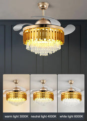 Gold ceiling fan with light fixture against a dark wall