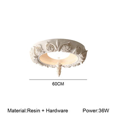 Decorative ceiling light fixture with intricate design on a white background