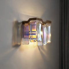 Detail of the polished chrome frame and faceted crystal arrangement on a chandelier
