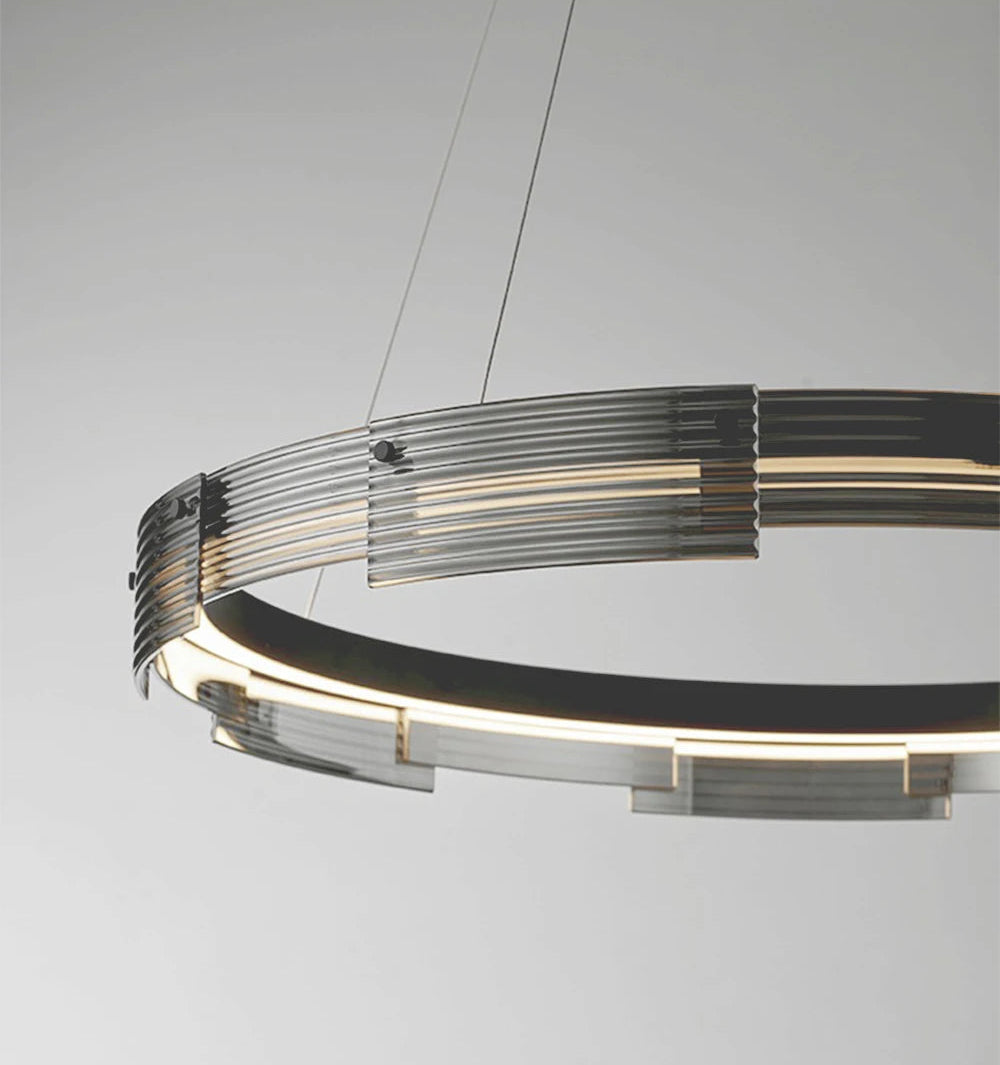 Modern chandelier with circular design on a gray background