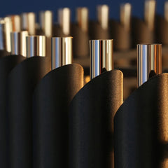 Close-up of metallic cylindrical objects with a blurred background