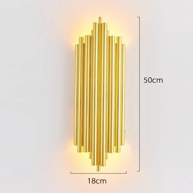 Gold wall-mounted lamp with dimensions on a light gray background