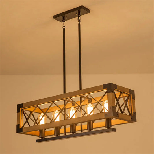 Rectangular industrial pendant light with wood frame and dark metal cage, featuring five exposed bulbs hanging from a central bar, suspended by rods from a ceiling plate.