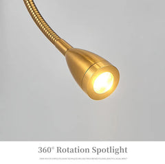 Gold spotlight with flexible neck on a gray background