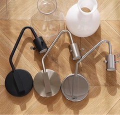 Three wall-mounted lamps on a wooden floor with Huouweii branding.