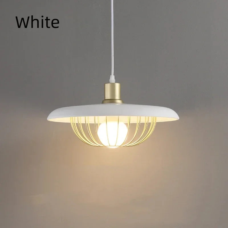 Modern pendant light with white shade and gold fixture on a gray background