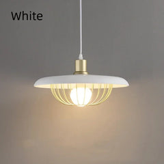 Modern pendant light with white shade and gold fixture on a gray background