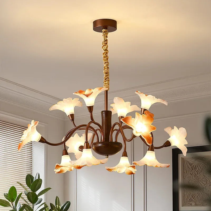 Angled view of the bronze floral bud chandelier pendant light showing its multi-arm structure.