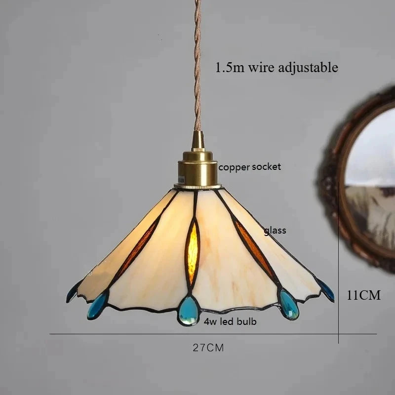 Pendant light with stained glass shade on a gray background