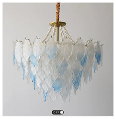 Chandelier with leaf-like design on a gray background