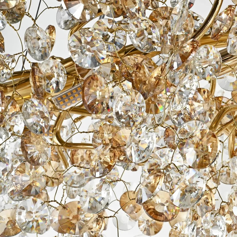 Close-up of a crystal chandelier with gold accents